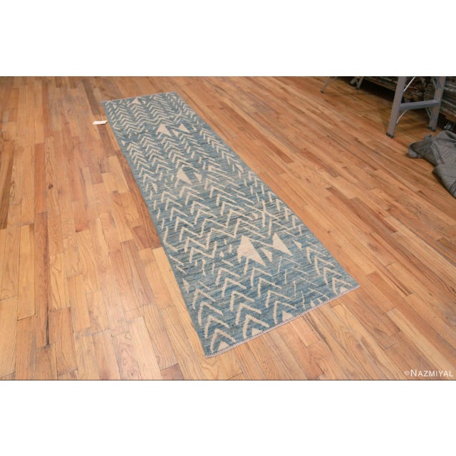 An Artistic and Decorative Light Blue Abrash Background and Tribal Geometric Ivory White Pattern Modern Hallway Runner...