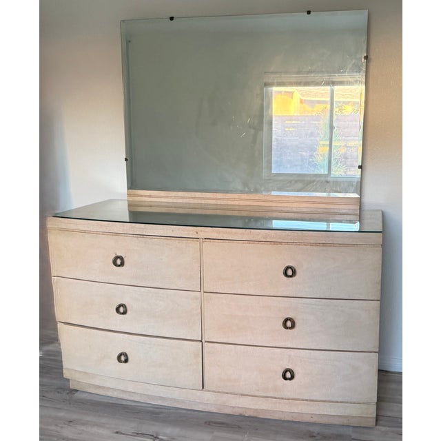 A refined 1940s Art Deco “Waterfall” bedroom suite crafted in warm birch veneer, featuring softly curved drawer fronts and...