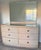 A refined 1940s Art Deco “Waterfall” bedroom suite crafted in warm birch veneer, featuring softly curved drawer fronts and...
