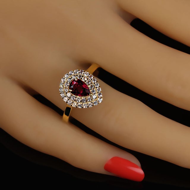 This is part of Chairish’s Fine Jewelry assortment. Exquisite Rubelite Ring Surrounded by Sparkling White Sapphires in...