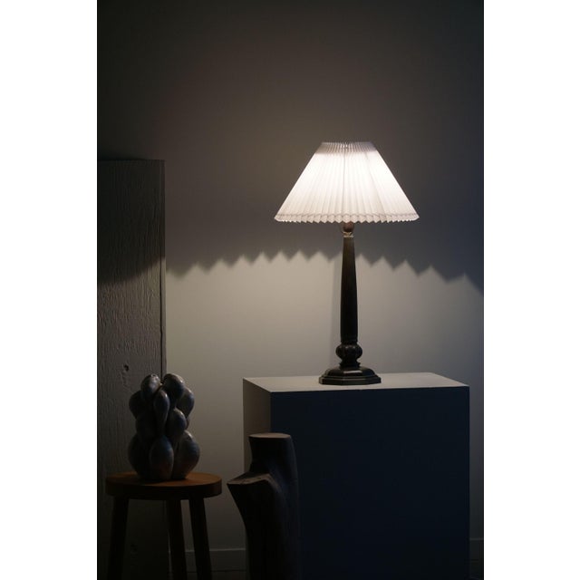 A stunning and rare table lamp in patinated disko metal. Made by Danish designer Just Andersen in 1920s. Model 2288,...