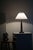 A stunning and rare table lamp in patinated disko metal. Made by Danish designer Just Andersen in 1920s. Model 2288,...