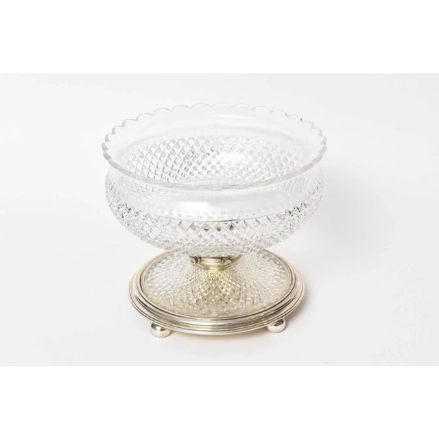 Silver plate with beautiful criss-cross cut-glass piece with scapploed edge on one side and finger tip presses on top and...