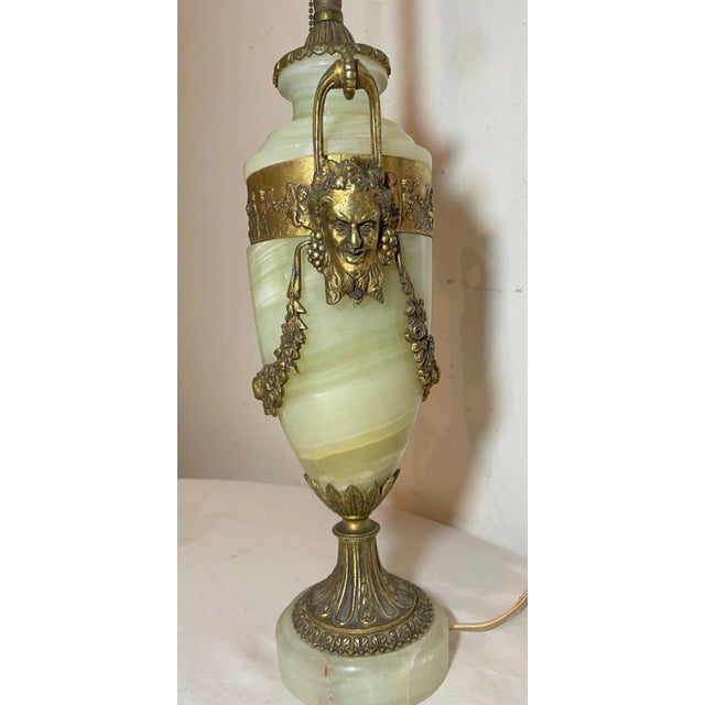 Experience the elegance of the Victorian era with this exquisite green onyx and gold gilded bronze figural table lamp. The...