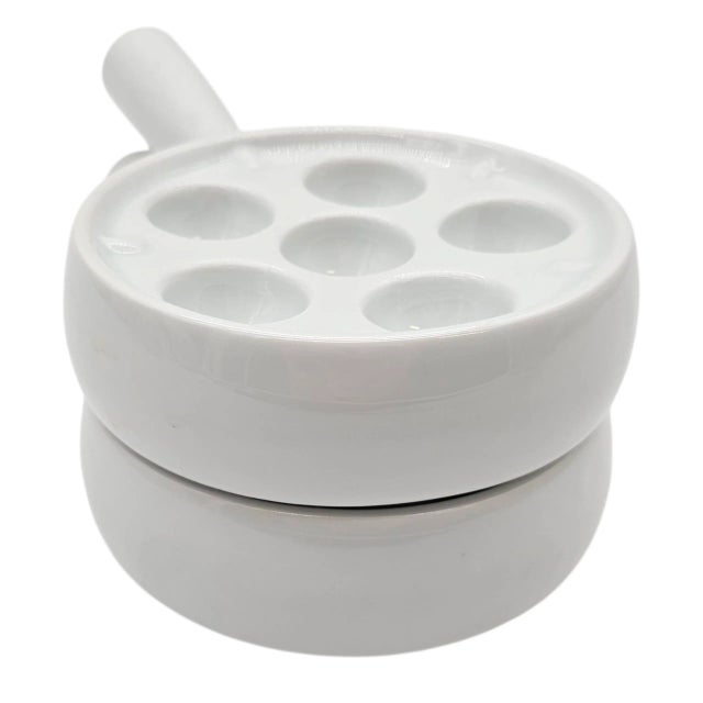 Elegant, unhurried, and distinct—these two white ceramic escargot dishes whisper of bistro evenings and rich Burgundy...