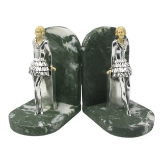 Vintage Art Deco Resin and Metal Bookends Featuring Lady Leaning on a Wall - a Pair For Sale