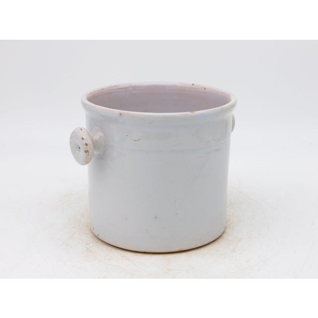 This charming 19th-century French stoneware confit pot features a soft cream glaze and classic, rounded form. Subtle...