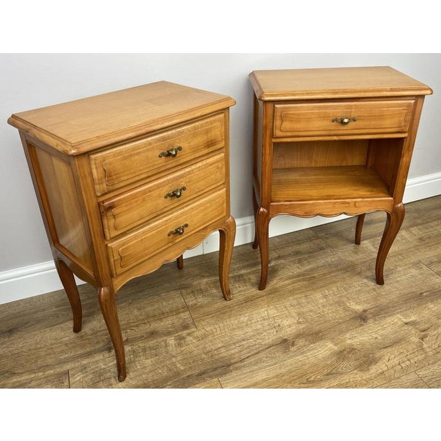 A beautiful set of Vintage French Louis bedside tables, combining elegant curves with practical design. This charming pair...