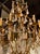Transitional Antique French Gilt Iron and Rock Crystal Chandelier For Sale - Image 3 of 7