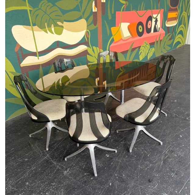 The less commonly seen Howell lucite and chrome dining set, which is often confused with a very similar set designed by...
