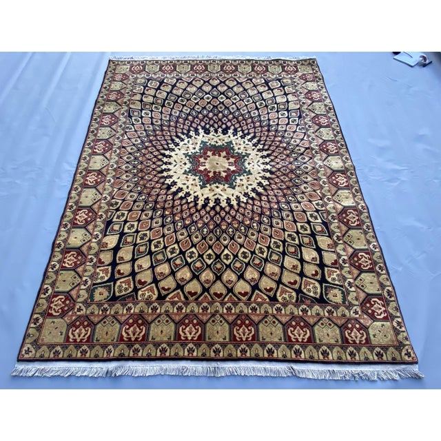 This hand-knotted Afghan wool rug is inspired by Persian Kerman design, featuring a striking central medallion surrounded...