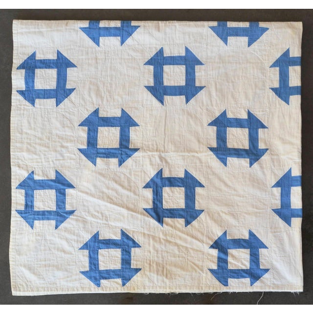 This is a beautiful hand-quilted summer-weight cotton quilt in a delightfully simple pattern of sky blue on an off-white...