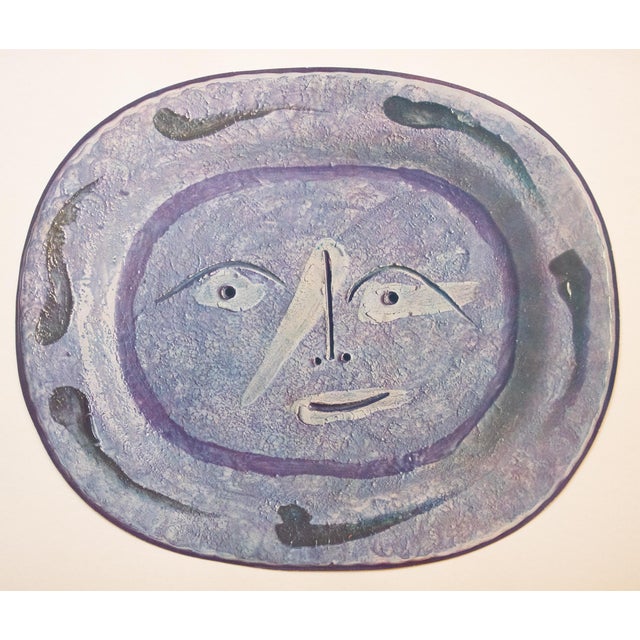 A stunning vintage period print of Pablo Picasso's ceramic Platter depicting a Young Smiling Face. Comes from an art folio...