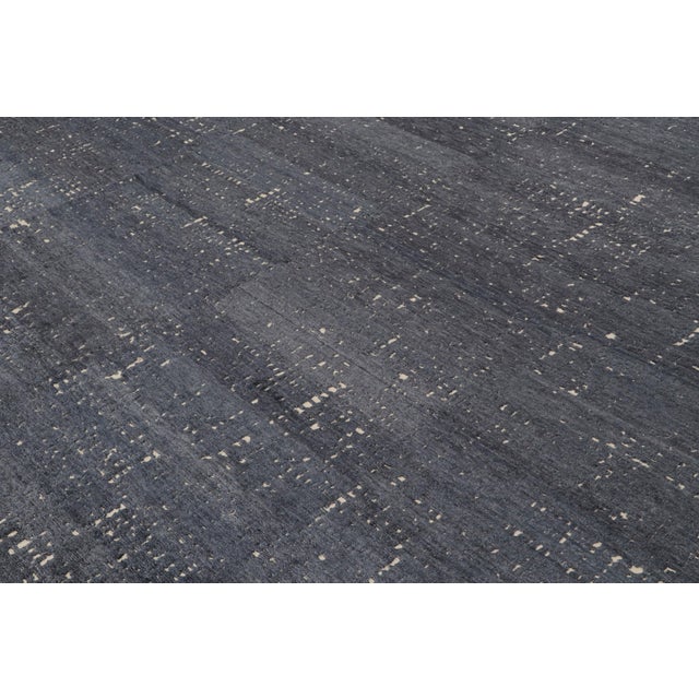 Hand-knotted in silk, this 10x14 contemporary rug by Rug & Kilim represents their “City Lights” design in grisailles...