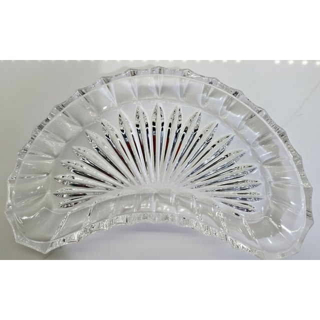 These sparkling crescent-shaped dishes feature a classic pressed glass sunburst pattern that beautifully catches the...