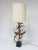 This dramatic large-scale table lamp by Bijan of California for Laurel is titled “Setarrah”. It has a base that is a...