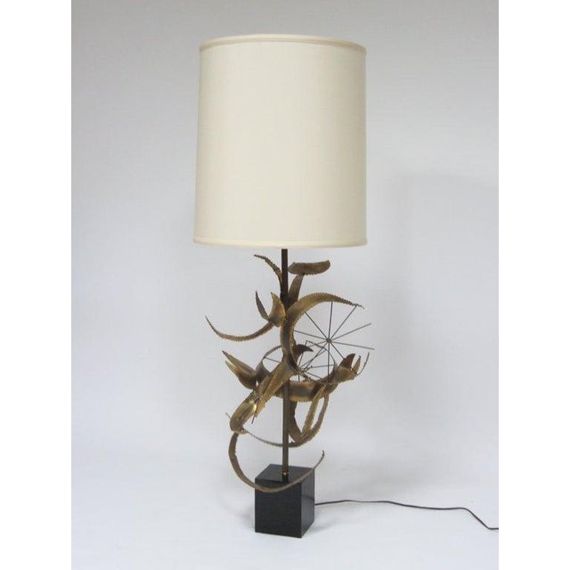 This dramatic large-scale table lamp by Bijan of California for Laurel is titled “Setarrah”. It has a base that is a...