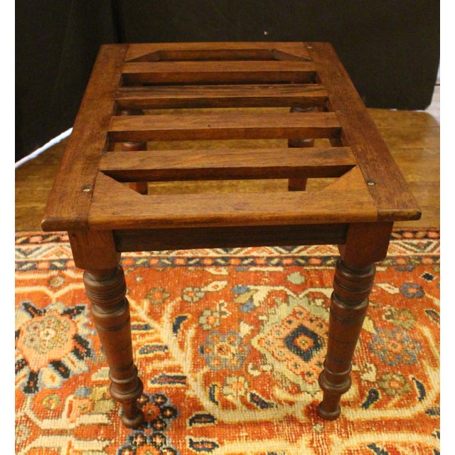 Circa 1880 English rectangular luggage rack stand. Mahogany. Boldly ring turned, tapers legs with Eastlake influence line...