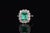 Gorgeous 18K solid gold 3.10CTS diamond and emerald ring. This ring features a beautifully crafted halo design with a...