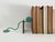Stunning and rare vintage postmodern pair of bookends made of steel, finished in a vibrant verdigris, and showcasing a...