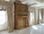 Antique, turn of the century oversized Italian Mediterranean fireplace mantel decorated with carvings and ornamental gold...