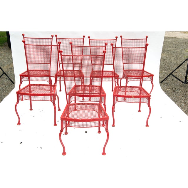Spectacular and timeless Mid-Century Modern Russell Woodard wrought iron dining chairs in original red paint. Mesh seat,...