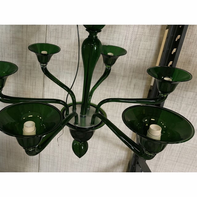 Contemporary Murano glass chandelier in decò style decorated in translucent dark green color which makes it extremely...