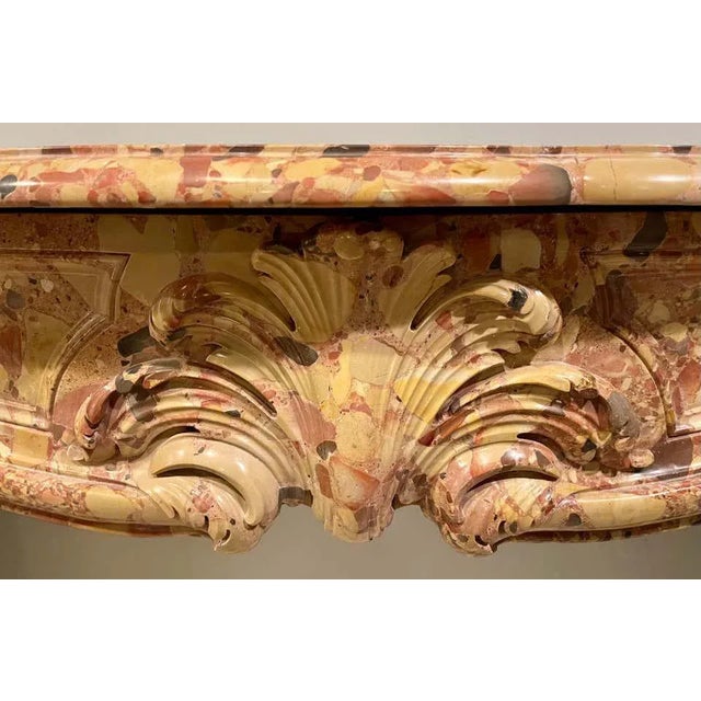 French Louis XVI style Brèche de Sicile marble mantel surround with white veining, the serpentine shelf above a swept...