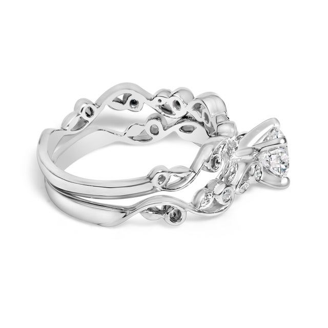 Imbued with timeless sophistication, this engagement ring and band set is a testament to eternal love, expertly crafted...
