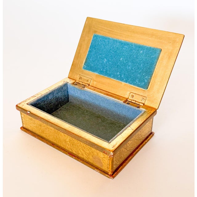 Stunning vintage French style gilt wood and eglomise box with a turquoise velvet lining. This piece looks to be French or...