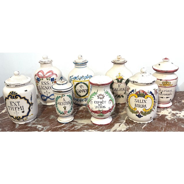 Set of 8 Italian Hand-Painted Apothecary Jars with Lids, Montelupo, Tuscany A richly decorative set of eight Italian...