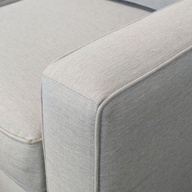 This Pottery Barn sectional sofa features a modern L-shape and soft neutral fabric. The cushions are plush and supportive,...