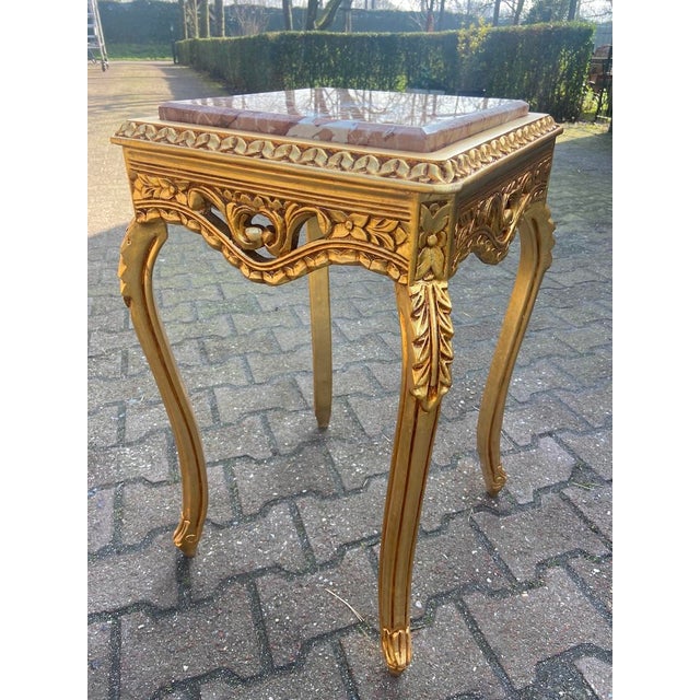 Introduce refined French elegance into your interior with this beautiful pair of Louis XVI-style side tables, crafted in...