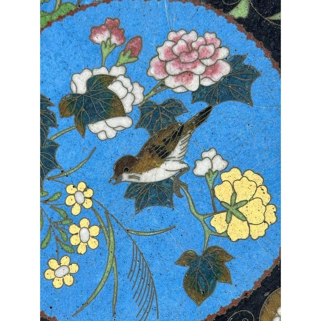 A bronze and cloisonné enamel round plate designed in Japan at the end of the 19th century, during the 'Meiji' era, which...