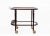 A charming early 20th century serving cart combining functionality and refined design. crafted in varnished wood, the cart...