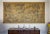 Tapestry with a romantic motif of a deep forest, a stream, waterfowl and a cottage hidden among the trees. The scene is...