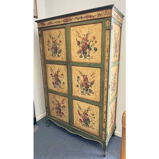 Timeless vintage wardrobe cabinet from the latter 20th century. The solid wood piece is made in the Tyrolean style with...