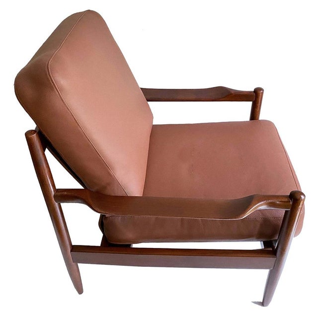 Pair of Vintage Danish modern lounge chairs attributed to Magnus Olesen featuring louvered organic-shaped backrests,...