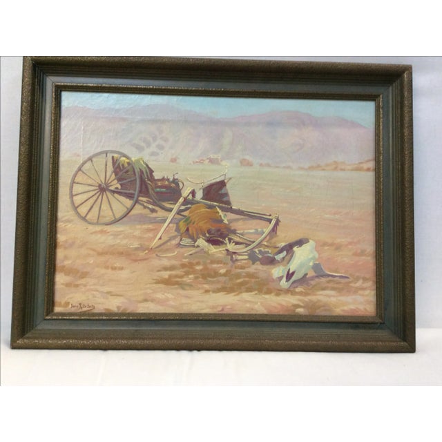 This is an unusual antique painting of the remains of a wagon and animal with mountains in the background. It is signed...