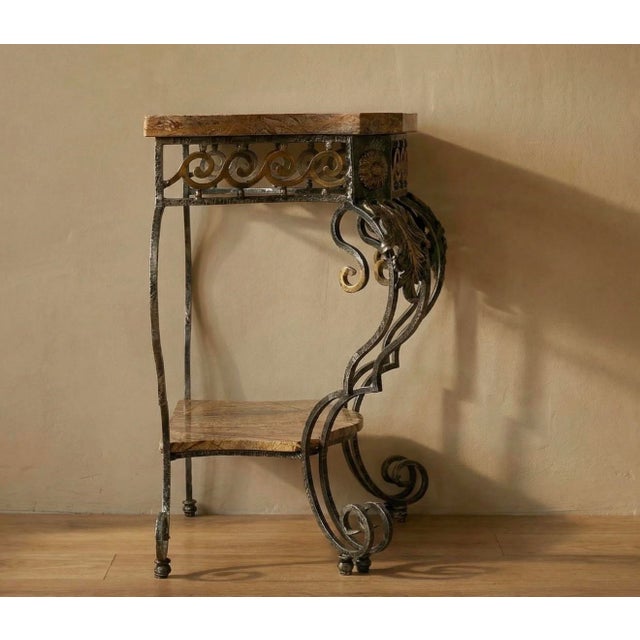 A striking Louis XVI–style console table by Theodore & Alexander, combining cast metal construction with a beautifully...
