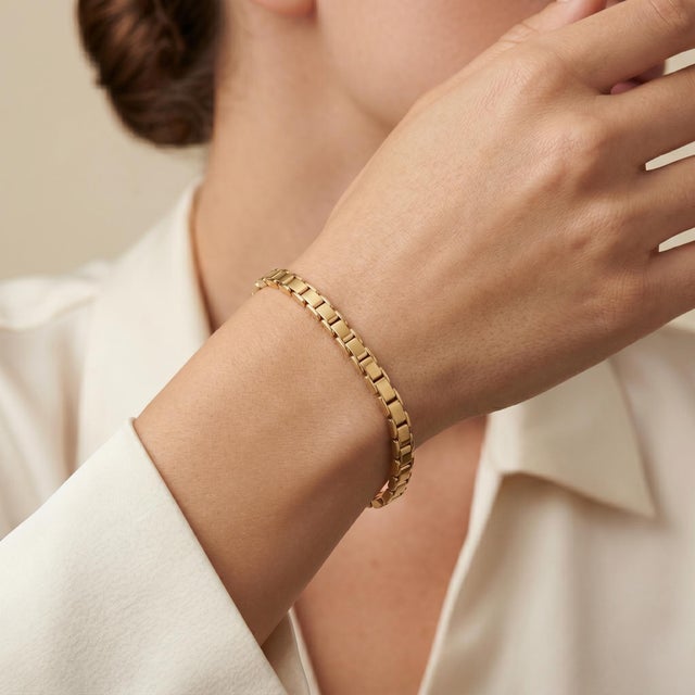 Elevate your accessory game with our exquisite 14k Yellow Gold Solid Link Chain Bracelet. Crafted from a single piece of...