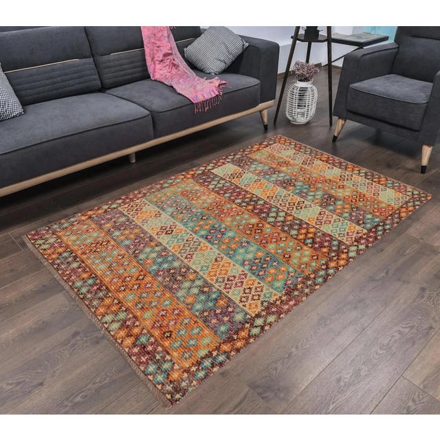 A mesmerizing addition to any decor, this exhilarating hand-knotted rug featuring exquisite coloration in an intricate...