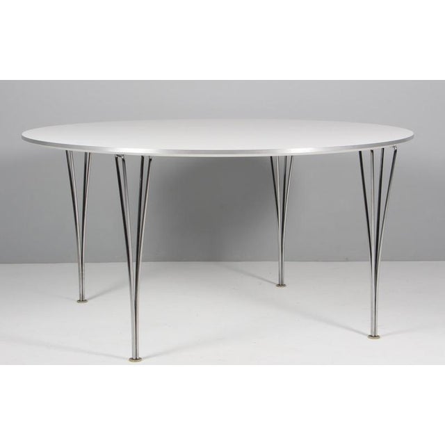 Piet Hein & Bruno Mathsson coffee table original laminate. Chromed Bruno mathsson legs. Made by Fritz Hansen. This piece...