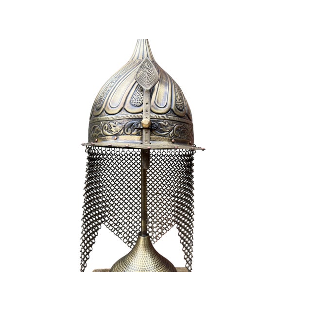 A monumental work of fine art metalwork, this heavy brass turban helmet is a profound display of traditional...