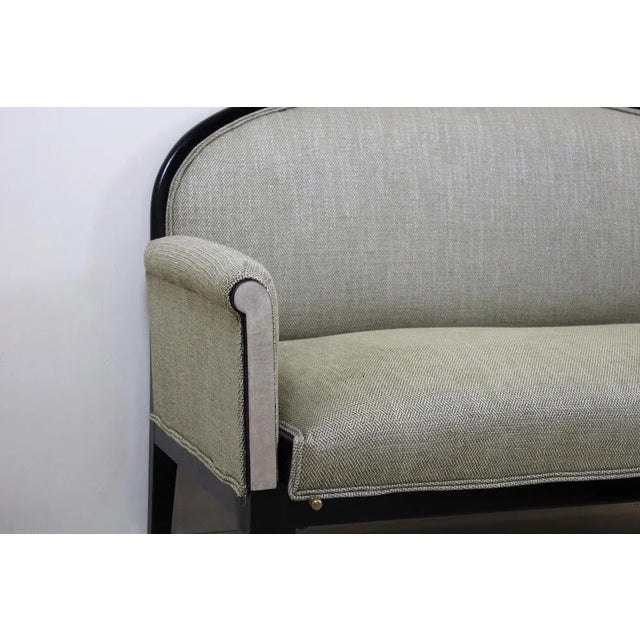 Elegant sofa of the 30s with original structure in black lacquered wood, brass and parchment details and new fabric...