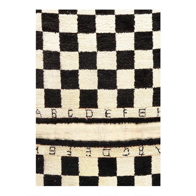 A pair All silk checkered Design rugs are distinguished by their excellent weave and by their remarkable adherence to the...