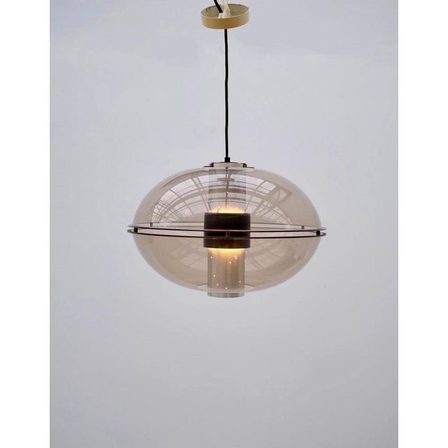 Orbiter Pendant in Metal and Acrylic Glass from Raak Amsterdam, Netherlands, 1970s, in Very Good conditions. Designed 1970...