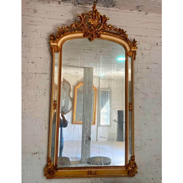 Make a statement with this magnificent French Louis XV-style wall mirror, featuring an elaborately ornamented frame...