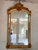 Make a statement with this magnificent French Louis XV-style wall mirror, featuring an elaborately ornamented frame...