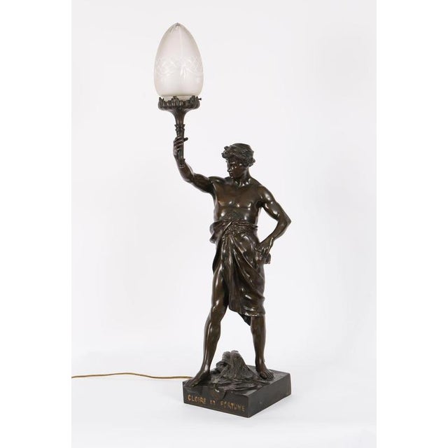 This is a magnificent large antique french bronze sculptural lamp depicting the model 'gloire et fortune', by the renowned...